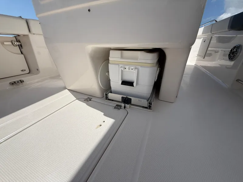 Slide: The Image of 2023 Robalo R272 Center Console boat with built-in storage compartment. - 39