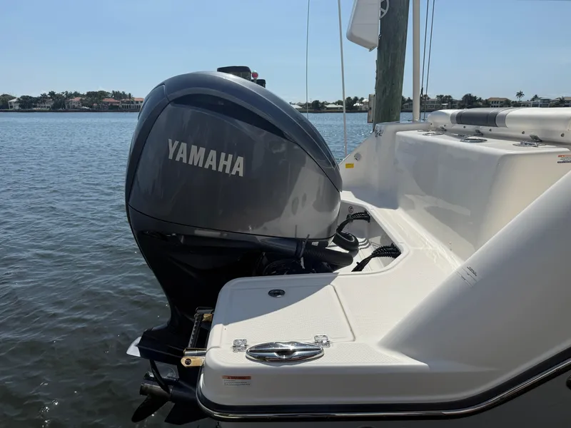 Slide: The Image of 2023 Robalo R272 Center Console with Yamaha outboard engine on calm water. - 9