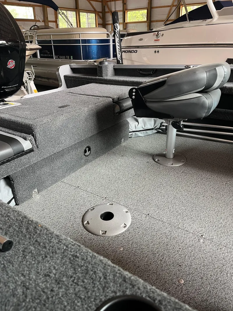 Slide: The Image of 2019 Lund 1775 Adventure Sport boat interior with seating and storage. - 5