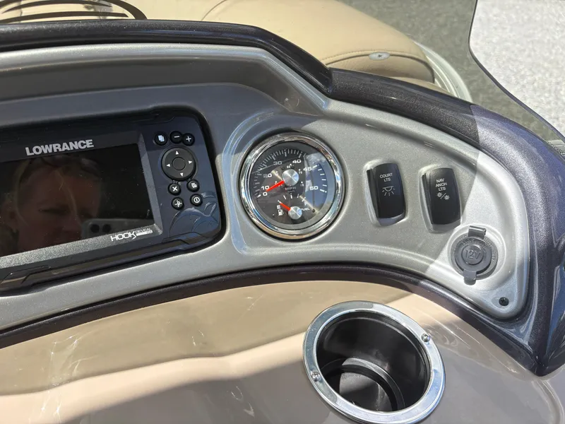 Slide: The Image of Dashboard of 2022 Sun Tracker Party Barge 24 DLX with Lowrance display and gauges. - 15