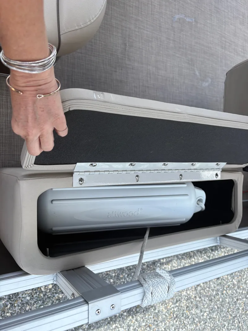 Slide: The Image of 2022 Sun Tracker Party Barge 24 DLX storage compartment with fender inside. - 18