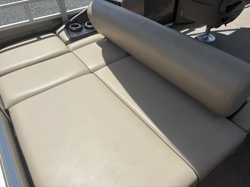 Slide: The Image of 2022 Sun Tracker Party Barge 24 DLX interior seating with cup holders. - 19