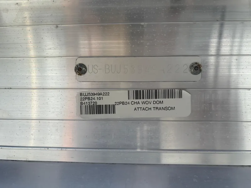 Slide: The Image of Label on 2022 Sun Tracker Party Barge 24 DLX, showing serial and model information. - 24