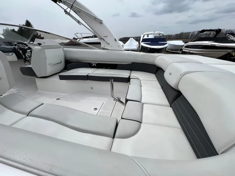 Slide: The Image of 2017 Regal 2700 boat interior with spacious white seating and sleek design. - 8