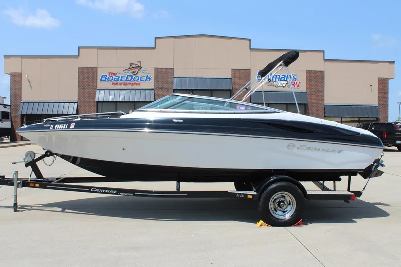 Slide: The Image of 2012 Crownline 21 SS boat on trailer, parked outside dealership. - 0