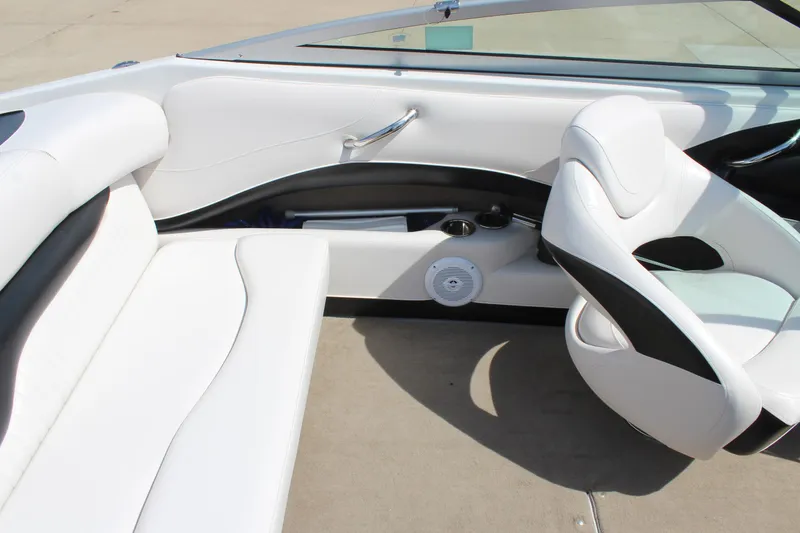 Slide: The Image of 2012 Crownline 21 SS boat interior with white and black seating. - 12