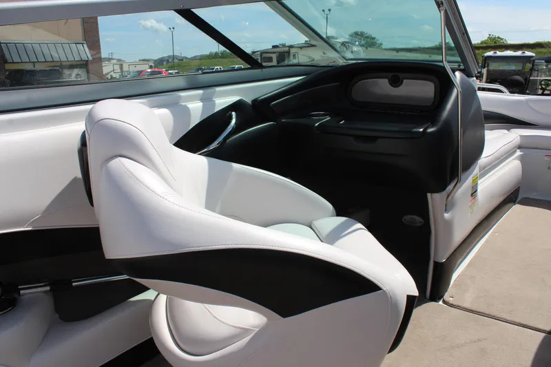 Slide: The Image of Interior of 2012 Crownline 21 SS boat with white and black seating. - 13