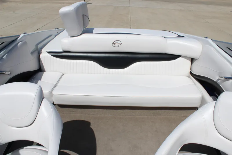Slide: The Image of 2012 Crownline 21 SS boat interior with white seating and sleek design. - 15