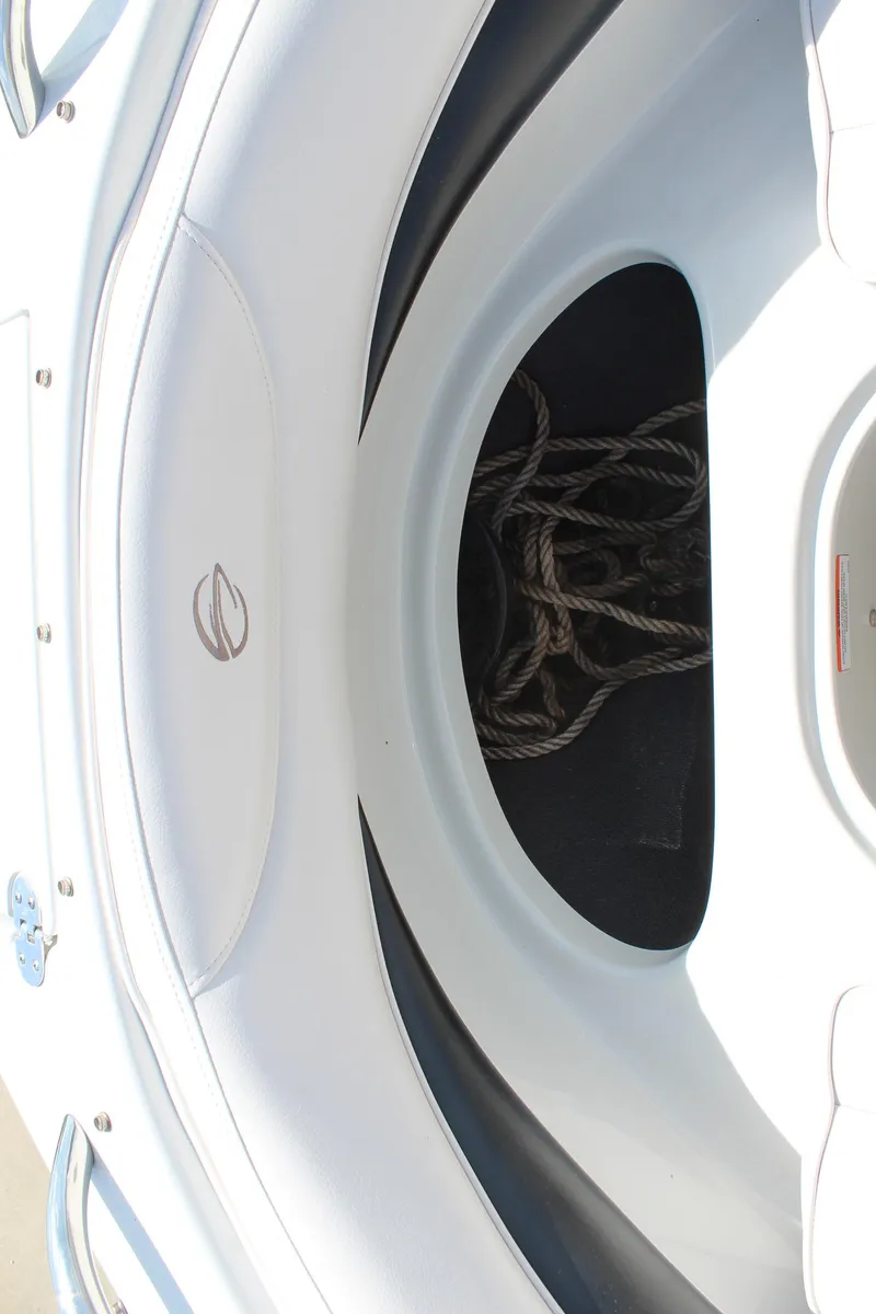 Slide: The Image of 2012 Crownline 21 SS boat anchor storage compartment with ropes. - 22