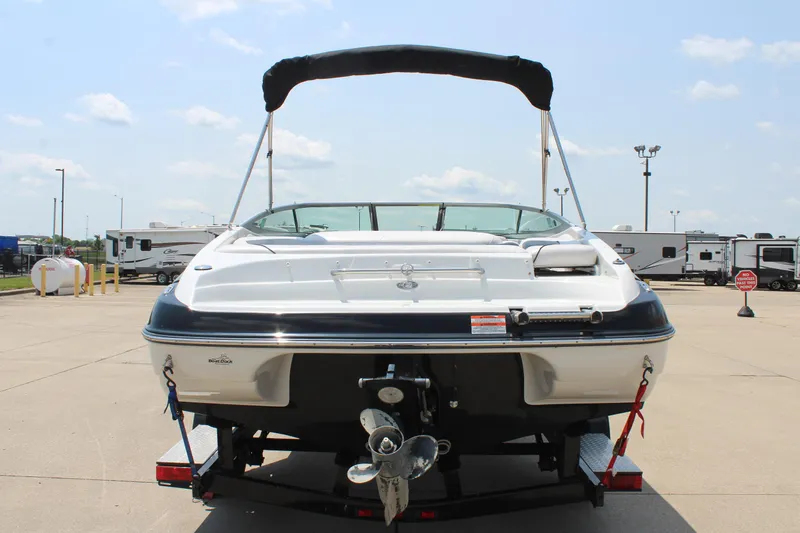 Slide: The Image of 2012 Crownline 21 SS boat on trailer, rear view, sunny day. - 6