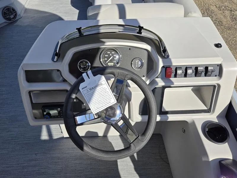 Slide: The Image of Steering console of 2025 Godfrey Xperience 2286 SBX Sport Tube boat, featuring gauges and controls. - 9