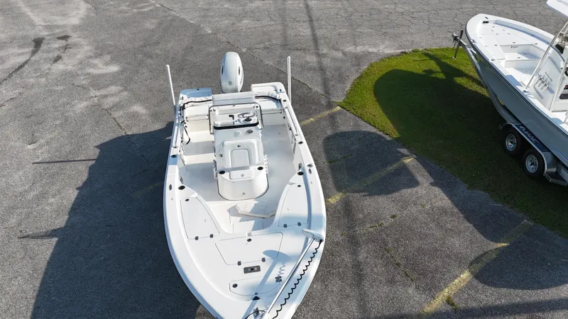Slide: The Image of 2021 Sea Pro 228 boat on pavement, aerial view, showcasing deck layout and design. - 4
