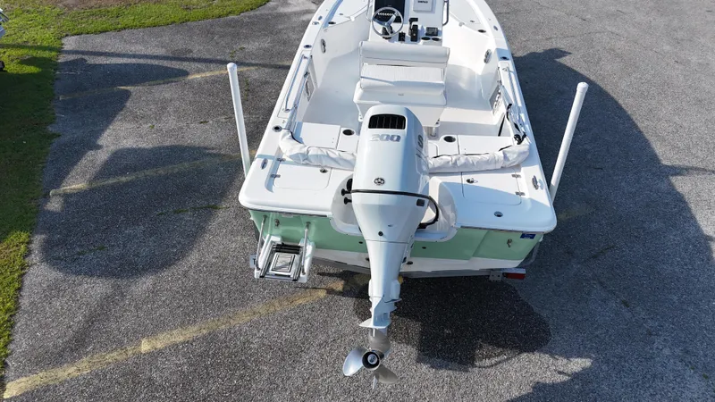 Slide: The Image of 2021 Sea Pro 228 boat, aerial view, parked on pavement. - 6