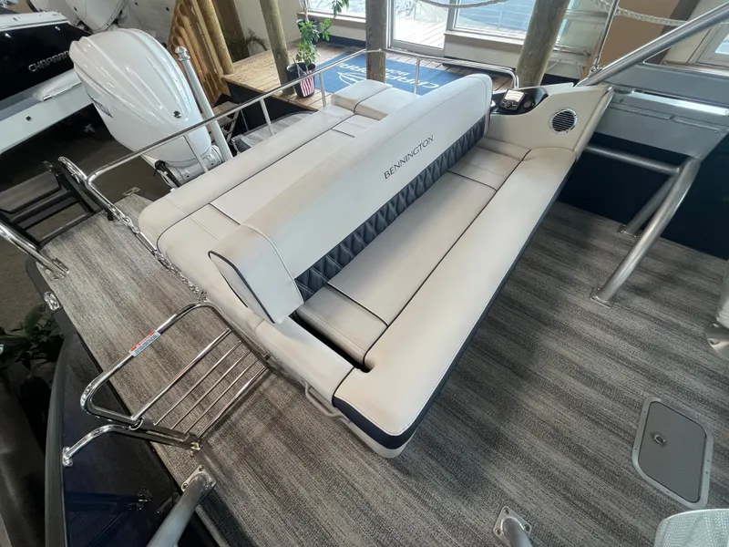 Slide: The Image of 2025 Bennington 25QXSBA boat interior with luxurious seating and modern design. - 12