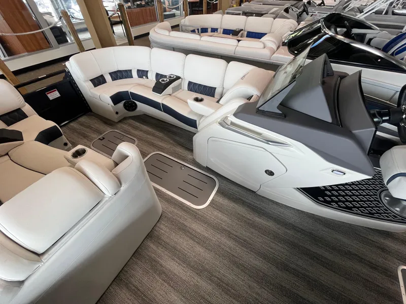 Slide: The Image of Luxurious interior of 2025 Bennington 25QXSBA pontoon boat with plush seating. - 14