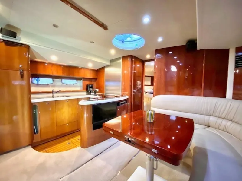 Slide: The Image of Luxurious interior of 2007 Fairline Targa 52 yacht with modern kitchen and seating area. - 16