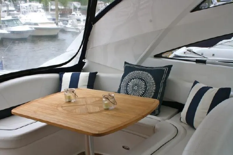 Slide: The Image of Luxurious 2007 Fairline Targa 52 yacht interior with elegant seating and wooden table. - 19