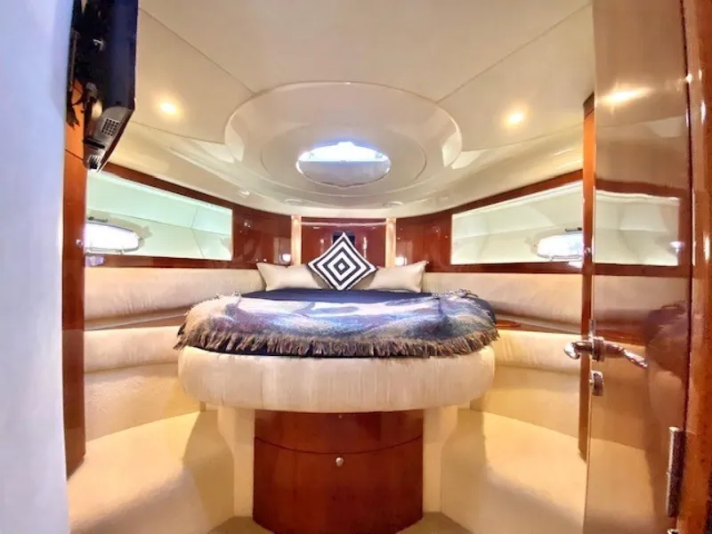 Slide: The Image of Luxurious cabin interior of 2007 Fairline Targa 52 yacht with elegant bedding and wood finishes. - 7