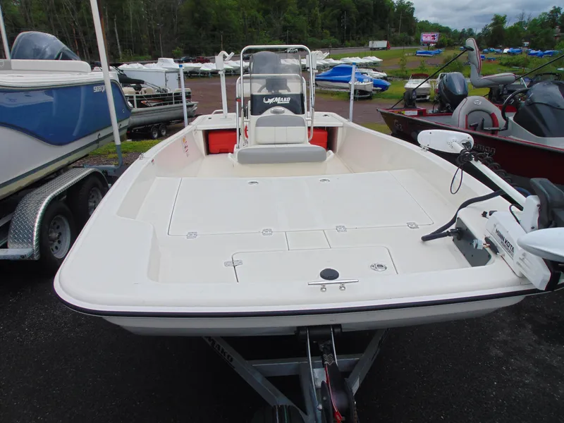 Slide: The Image of 2023 Mako Pro Skiff 17 CC boat on trailer, parked outdoors. - 3