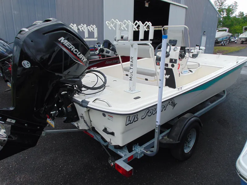 Slide: The Image of 2023 Mako Pro Skiff 17 CC boat with Mercury engine on trailer. - 4