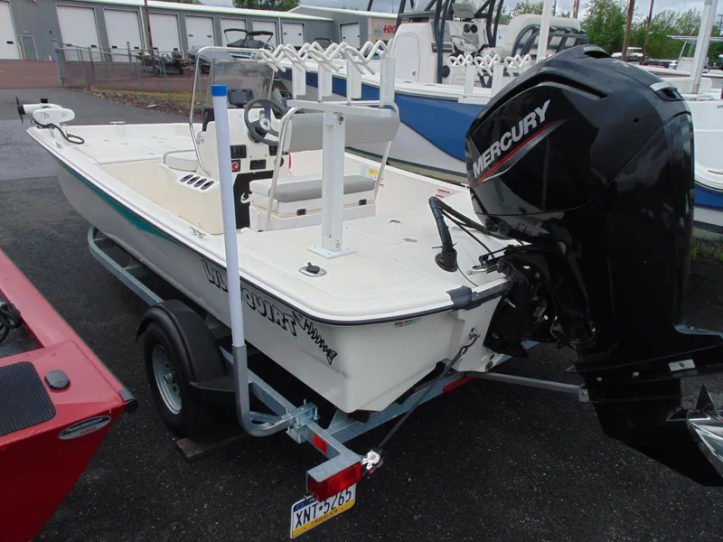 Slide: The Image of 2023 Mako Pro Skiff 17 CC boat with Mercury engine on trailer. - 5