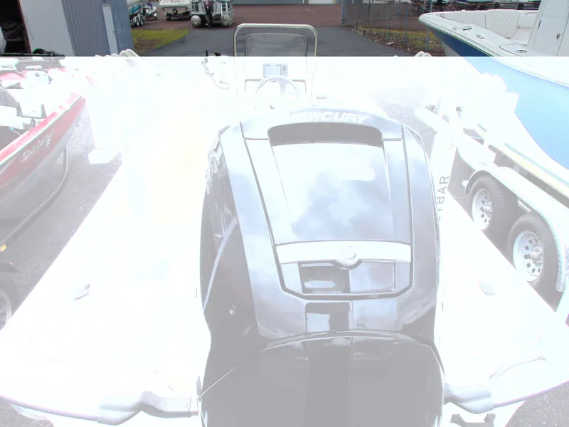 Slide: The Image of 2023 Mako Pro Skiff 17 CC with Mercury engine, parked outdoors. - 6