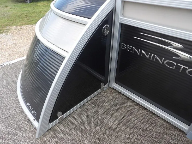Slide: The Image of 2016 Bennington 2874 QSR boat, black and silver exterior, close-up view. - 10