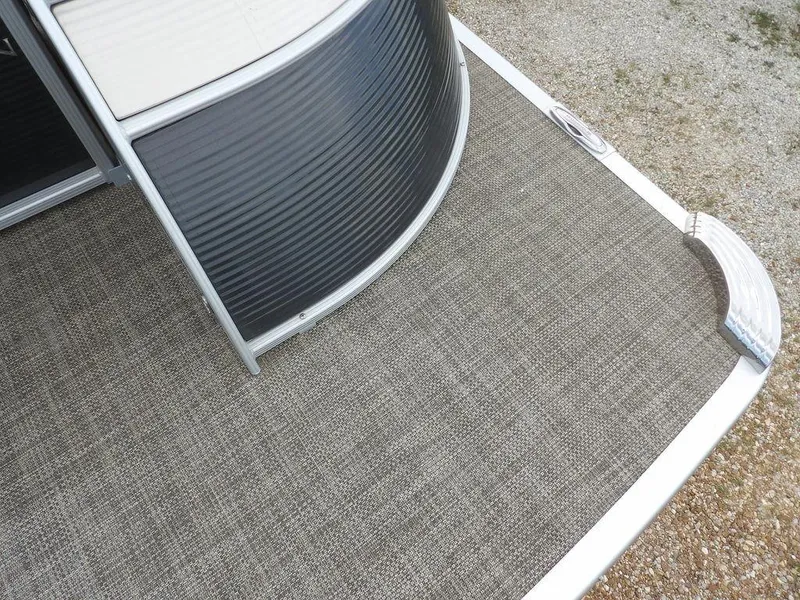 Slide: The Image of 2016 Bennington 2874 QSR pontoon boat deck with textured flooring. - 11