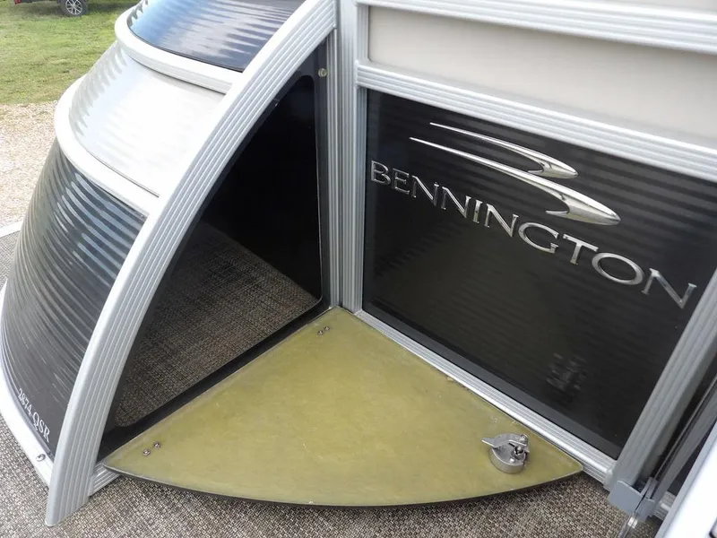 Slide: The Image of 2016 Bennington 2874 QSR pontoon boat with sleek design and logo detail. - 14