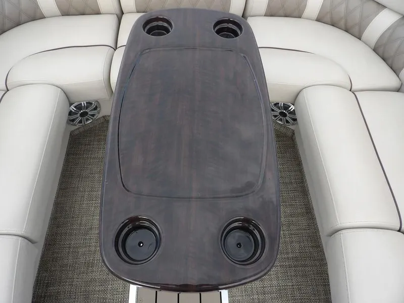 Slide: The Image of Luxurious seating and table on 2016 Bennington 2874 QSR pontoon boat. - 19