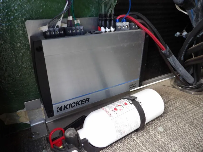 Slide: The Image of Kicker amplifier and fire extinguisher in 2016 Bennington 2874 QSR boat. - 32