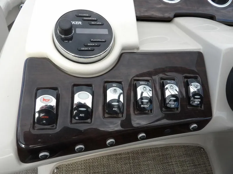 Slide: The Image of Control panel of 2016 Bennington 2874 QSR boat with various switches and controls. - 33