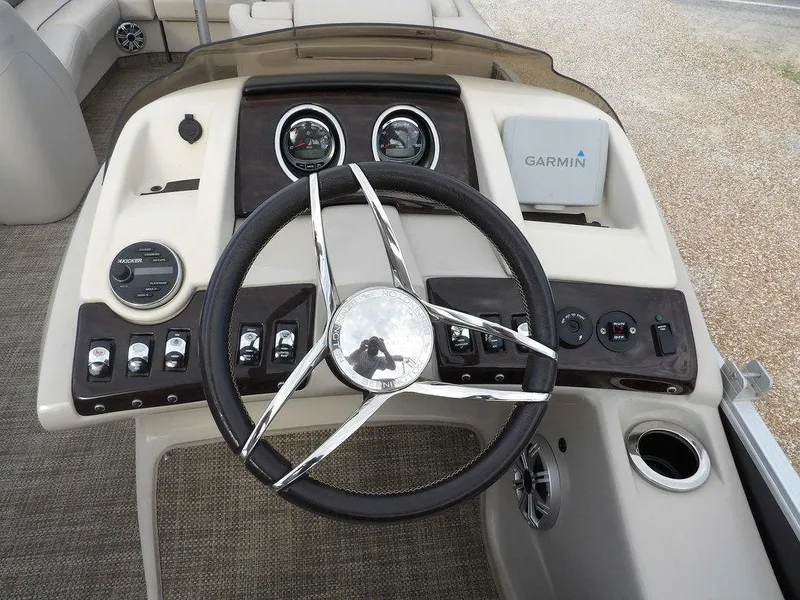 Slide: The Image of Steering console of 2016 Bennington 2874 QSR boat with Garmin navigation system. - 34
