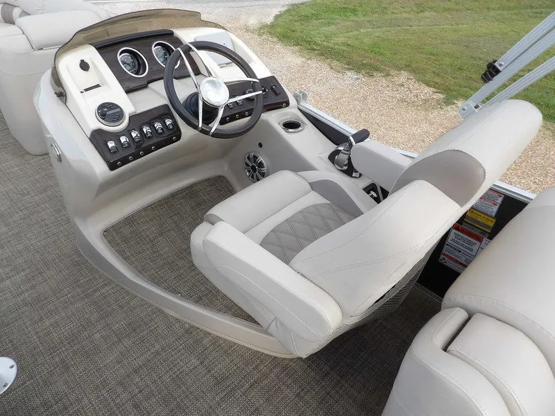 Slide: The Image of 2016 Bennington 2874 QSR boat interior with steering wheel and control panel. - 35