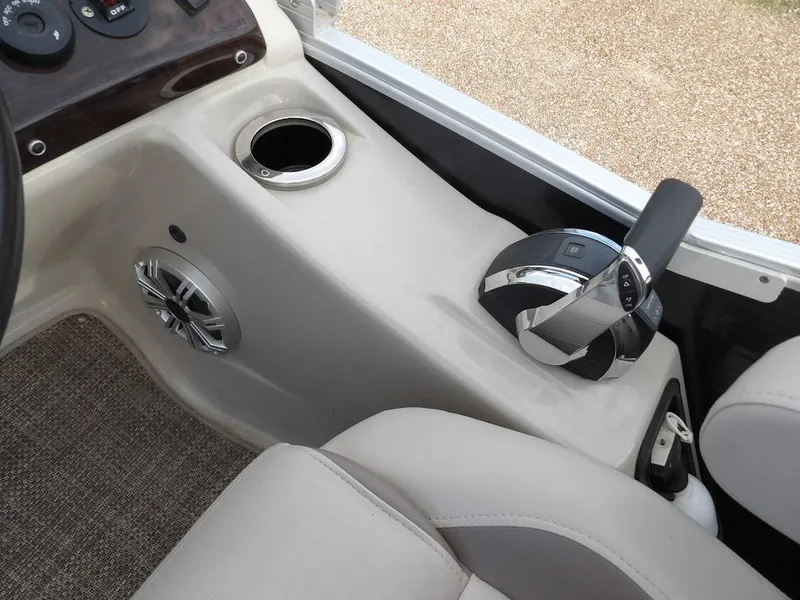 Slide: The Image of Interior of 2016 Bennington 2874 QSR boat with control lever and cup holder. - 40