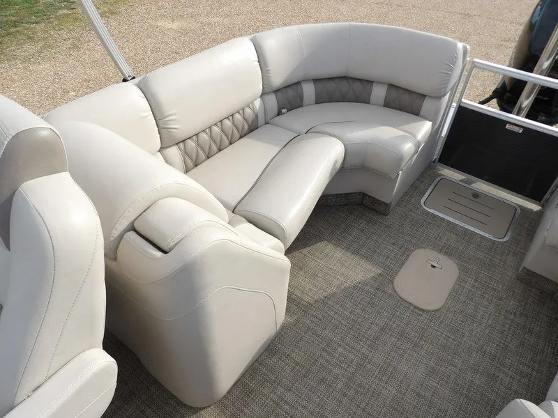 Slide: The Image of Luxurious seating on 2016 Bennington 2874 QSR pontoon boat, featuring plush, beige upholstery. - 43