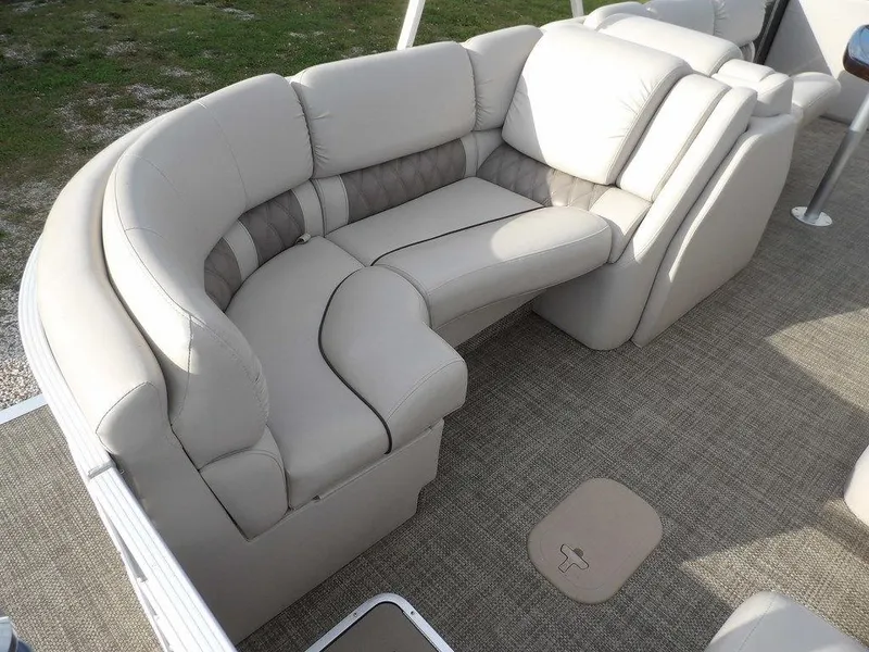Slide: The Image of 2016 Bennington 2874 QSR boat interior with plush seating and carpeted flooring. - 44
