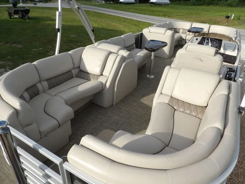 Slide: The Image of 2016 Bennington 2874 QSR pontoon boat with luxurious beige seating and modern design. - 47