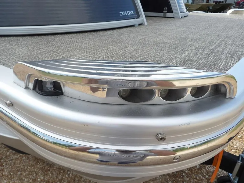 Slide: The Image of 2016 Bennington 2874 QSR boat detail with chrome accents and textured flooring. - 48