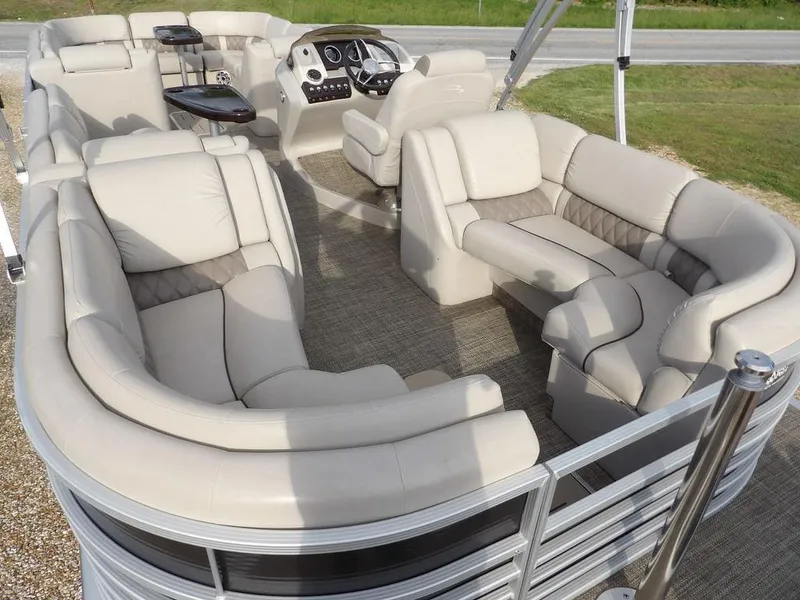 Slide: The Image of 2016 Bennington 2874 QSR pontoon boat with luxurious seating and modern dashboard. - 49