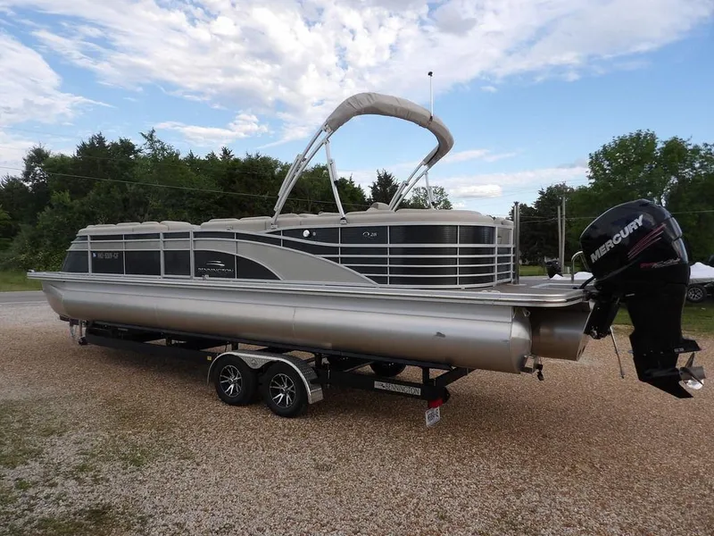 Slide: The Image of 2016 Bennington 2874 QSR pontoon boat on trailer, with Mercury outboard motor. - 6