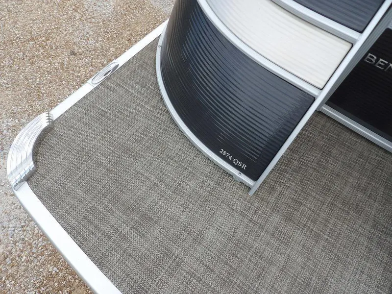 Slide: The Image of 2016 Bennington 2874 QSR pontoon boat deck with textured flooring. - 9