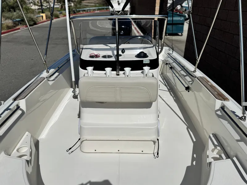 Slide: The Image of 2021 Boston Whaler 170 Montauk boat interior with seating and console. - 11