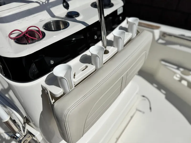 Slide: The Image of 2021 Boston Whaler 170 Montauk boat console with rod holders and seating. - 12