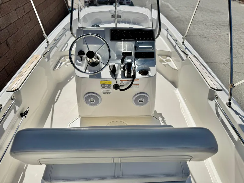 Slide: The Image of 2021 Boston Whaler 170 Montauk boat interior with steering console and seating. - 17