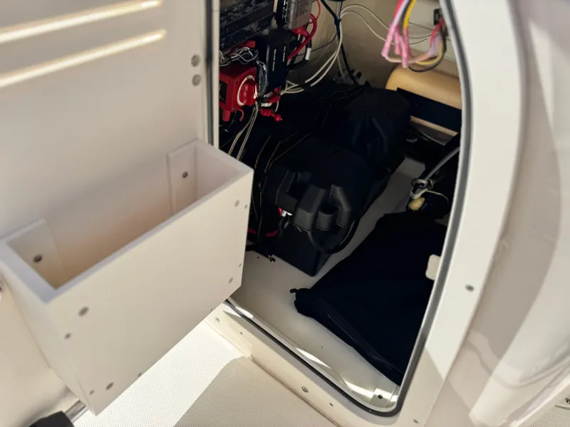 Slide: The Image of Interior view of a 2021 Boston Whaler 170 Montauk boat's storage compartment. - 23