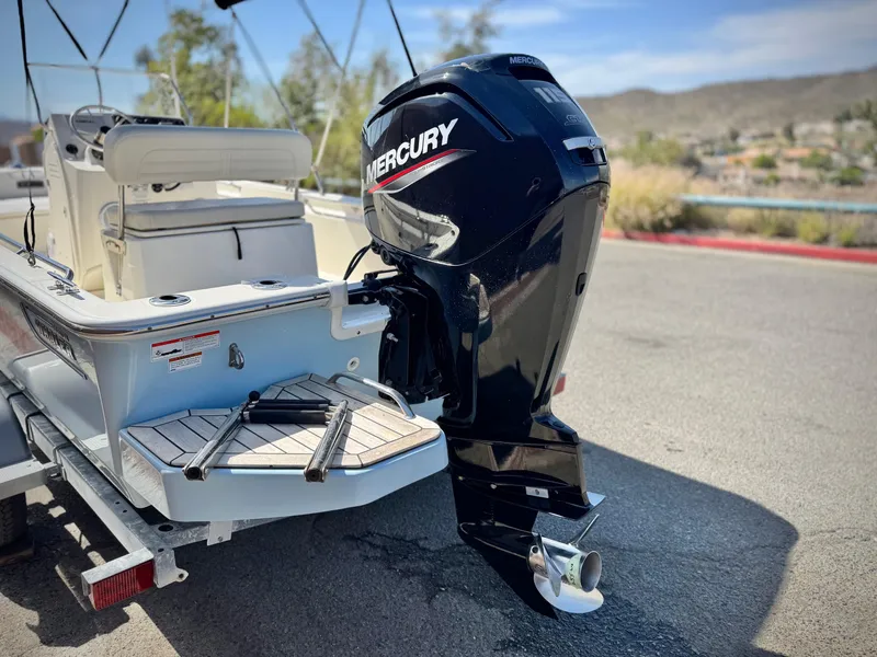 Slide: The Image of 2021 Boston Whaler 170 Montauk with Mercury outboard motor on trailer. - 6