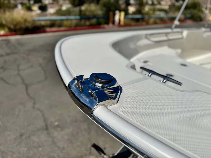 Slide: The Image of 2021 Boston Whaler 170 Montauk boat detail, featuring a chrome cleat on the bow. - 7