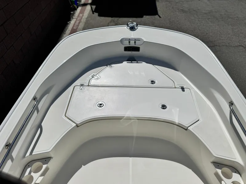 Slide: The Image of 2021 Boston Whaler 170 Montauk boat interior, featuring sleek white deck design. - 9