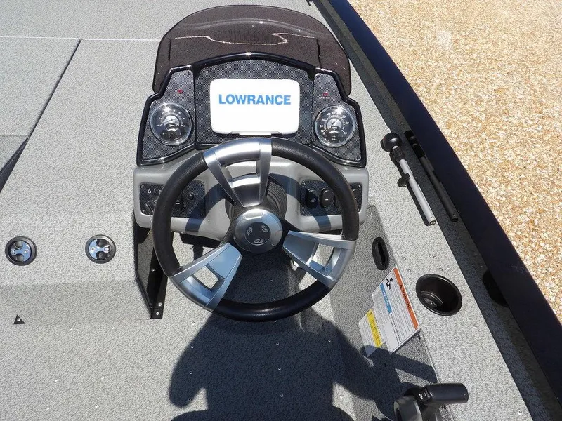 Slide: The Image of 2020 G3 Sportsman 1810 boat dashboard with Lowrance display and steering wheel. - 17